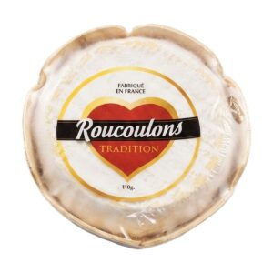 Formaggio francese Roucoulons Tradition a pasta molle e crosta lavata ambrata, tagliato per mostrare il cuore cremoso e scioglievole